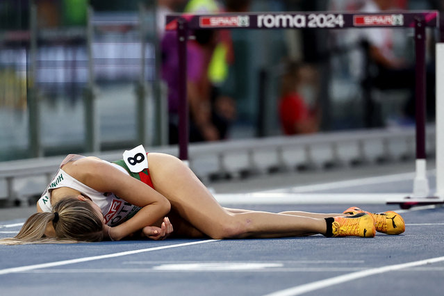 Hungary's athlete Anna Toth lies on track after a fall in the women's 100m hurdles semifinal during the European Athletics Championships at the Olympic stadium in Rome on June 8, 2024. (Photo by Anne-Christine Poujoulat/AFP Photo)