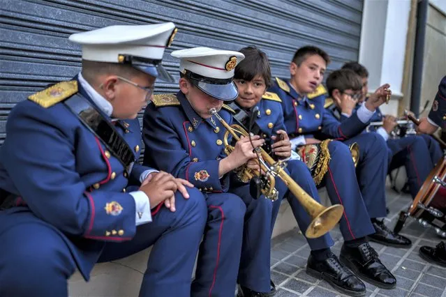 Members of the band practice prior to the procession at the Veracruz church in Aguilar de la Frontera, southern Spain, Tuesday, April 4, 2023. Hundreds of processions take place throughout Spain during the Easter Holy Week. (Photo by Manu Fernandez/AP Photo)