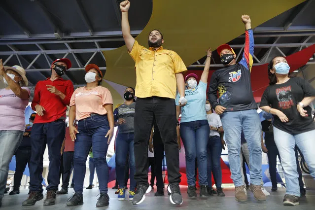 Nicolas Maduro Guerra, son of Venezuela's President Nicolas Maduro, campaigns for a spot in the National Assembly for the upcoming Dec. 6 midterm elections, in Maiquetía, Venezuela, Sunday, November 29, 2020. (Photo by Ariana Cubillos/AP Photo)