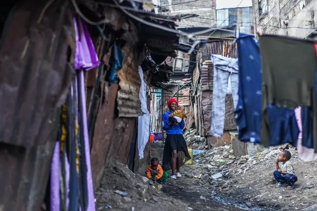A mother is seen with her child on Mothers' Day at Mathare slum of Nairobi, Kenya on May 13, 2023. (Photo by Gerald Anderson/Anadolu Agency via Getty Images)