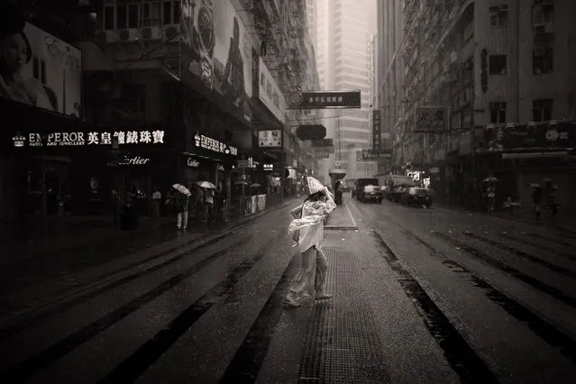“Chick dropped in soup”. No, not chicken soup..... It's a literal translation of a Chinese expression for being drenched （落湯雞）。 Caught this well dressed lady trying to cross the street in a torrential down pour. Location: Hong Kong. (Photo and caption by Brian Yen/National Geographic Traveler Photo Contest)