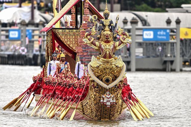Thai oarsmen row a royal barge during the Royal Barge Procession along the Chao Phraya River in Bangkok on October 27, 2024. (Photo by Manan Vatsyayana/AFP Photo)
