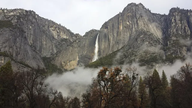 In this photo provided by the National Park Service, Upper Yosemite Falls flows at full force after two days of significant rainfall Wednesday, December 3, 2014, in Yosemite National Park, Calif. A second day of much-needed rain fell across drought-stricken California on Wednesday, but the storm had so far produced few of the problems such as flooding and mudslides that had threatened areas left barren by wildfires. (Photo by AP Photo/National Park Service)