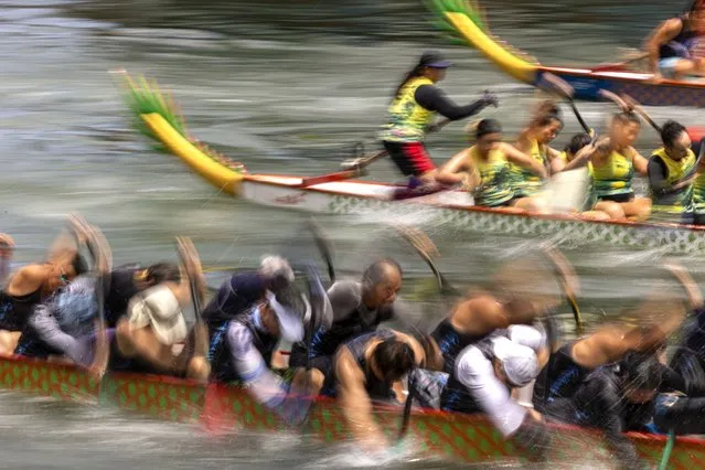 Competitors take part in the annual dragon boat race to celebrate the Tuen Ng festival in Hong Kong, Thursday, June 22, 2023. (Photo by Louise Delmotte/AP Photo)