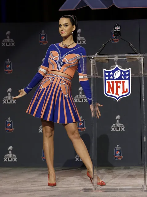 Katy Perry shows off her dress at a halftime news conference for NFL Super Bowl XLIX football game Thursday, January 29, 2015, in Phoenix. (Photo by Morry Gash/AP Photo)