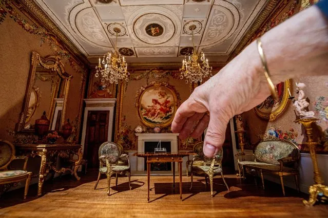 Jane Fiddick with the perfect replica of the Chippendale Table that stand in the main house at Newby Hall, United Kingdom and then places the Table in the Dolls House on April 15, 2022. (Photo by Charlotte Graham/CAG Photography Ltd)