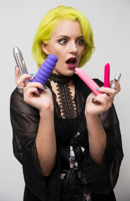 A girl with vibrators on white background. (Photo by Neil Hall/Getty Images)