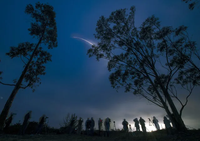 In this handout provided by National Aeronautics and Space Administration (NASA), in a long exposure a United Launch Alliance Delta II rocket with the Soil Moisture Active Passive (SMAP) observatory onboard launches from Space Launch Complex 2, January 31, 2015 in Vandenberg, California. (Photo by Bill Ingalls/NASA/Getty Images)