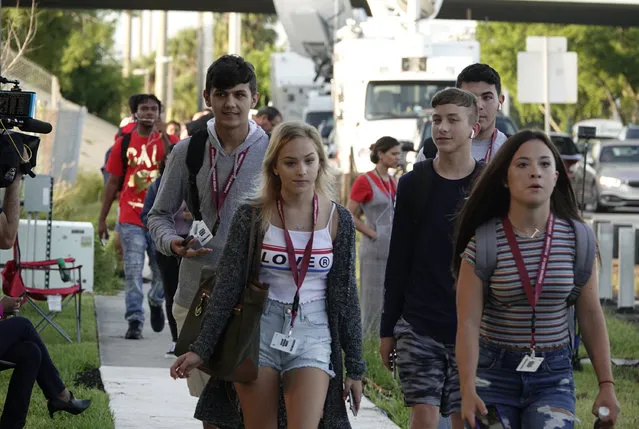 Students arrive at Marjory Stoneman Douglas high school in Parkland, FL, on the first day of school Wednesday, August 15, 2018.  Broward County Public Schools Superintendent Robert Runcie said Wednesday that the start of a new school year at Marjory Stoneman Douglas High School in Parkland is “a challenging time” for students, teachers and other school employees. (Photo by Joe Cavaretta/South Florida Sun-Sentinel via AP Photo)