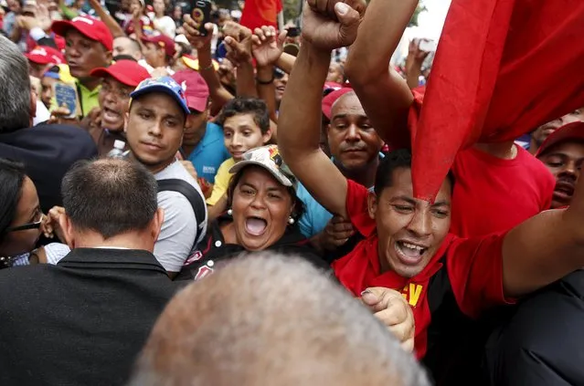 Supporters of Venezuela's President Nicolas Maduro react as official deputies leave the building housing the National Assembly in Caracas, January 5, 2016. (Photo by Christian Veron/Reuters)