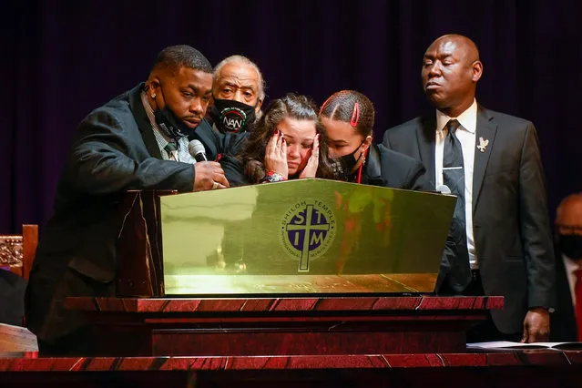 Daunte Wright's father Aubrey Wright (L) talks about his son as Wright's mother Katie Wright (C) become emotional as attorney Ben Crump (R) and Rev. Al Sharpton (2-L) look on during the funeral at Shiloh Temple International Ministries in Minneapolis, Minnesota, USA, 22 April 2021. On 11 April 2021, Daunte Demetrius Wright, 20, was fatally shot by police officer Kimberly Ann Potter in Brooklyn Center, Minnesota during a traffic stop. (Photo by Craig Lassig/EPA/EFE)