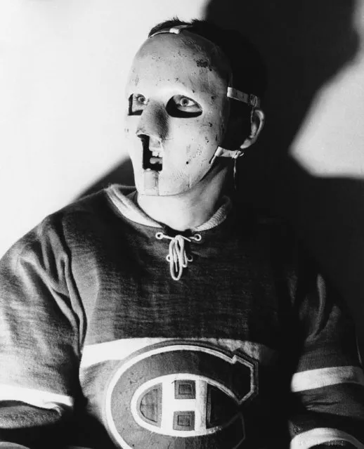 Jacques Plante, the masked goalie of the world champion Montreal Canadiens Jan. 30, 1960, said the eerie-looking face protector has ended a period of deep-rooted anxieties. “I’m rarely tense before a game,” said the colorful French Canadian who is rated the outstanding Netminder in the National Hockey League. “But before the mask it was always on my mind about getting hurt…or losing an eye or something. Now I know I won’t have to quit because of a facial injury. When I retire it will be because someone else is better. But I hope that with the mask I can play until I’m 40.” Plante, 31, his face marked by injuries, has been the Canadiens’ regular goalie for the past six years. He is seeking a record fifth straight Vezina Trophy, awarded annually to the goalkeeper allowing the fewest goals. (Photo by AP Photo)