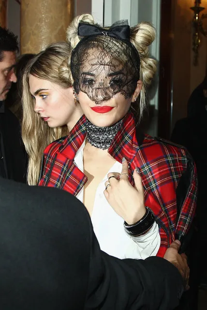 Rita Ora and Cara Delevingne leave the “Mademoiselle C” cocktail party at Pavillon Ledoyen on October 1, 2013 in Paris, France. (Photo by Julien M. Hekimian/Getty Images)