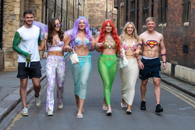 Students at prestigious Cambridge University dressed in daring and flamboyant costumes for their annual May Ball event on June 22, 2022. Unlike the other May Balls where students wear black ties and ball gowns, the King's Affair sees guests don fancy dress, with this year's theme being Metamorphis. (Photo by Geoff Robinson Photography/The Times)
