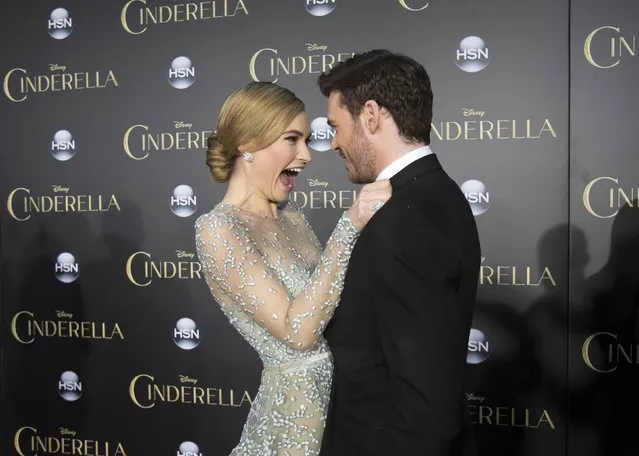 Cast members Lily James and Richard Madden greet each other at the premiere of "Cinderella" at El Capitan theatre in Hollywood, California March 1, 2015. The movie opens in the U.S. on March 13. REUTERS/Mario Anzuoni  (UNITED STATES - Tags: ENTERTAINMENT)