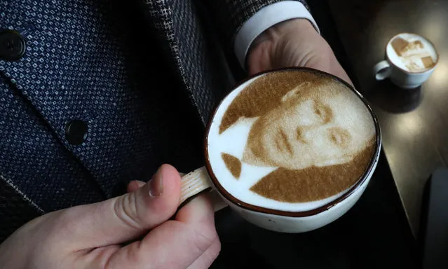 A cup of coffee with a portrait of President Vladimir Putin printed of the foam, at a Stories coffee shop in St Petersburg, Russia on November 1, 2018. (Photo by Alexander Demianchuk/TASS)