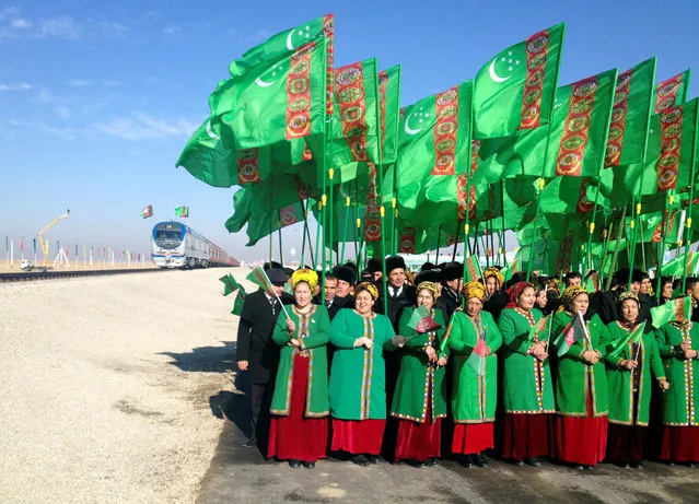 TURKMENISTAN: People attend the opening ceremony of a railway link to Afghanistan in the Ymamnazar customs control point, Turkmenistan, November 28, 2016. (Photo by Marat Gurt/Reuters)