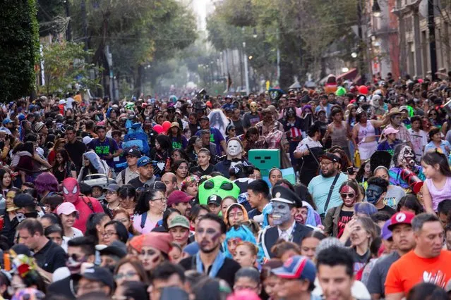 People attend the annual Zombie Walk in Mexico City, Mexico on October 21, 2023. (Photo by Quetzalli Nicte-Ha/Reuters)
