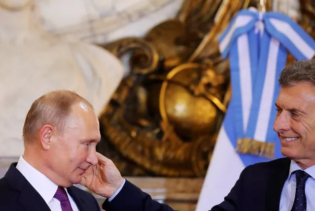 Russia's President Vladimir Putin meets with Argentina's President Mauricio Macri at the Casa Rosada Presidential Palace in Buenos Aires, Argentina December 1, 2018. (Photo by Marcos Brindicci/Reuters)