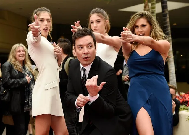 Jimmy Fallon, host of the 74th Annual Golden Globe Awards, poses with Miss Golden Globes 2017, from left, sisters Sistine, Scarlet and Sophia Stallone after rolling out the red carpet during Golden Globe Awards Preview Day at the Beverly Hilton on Wednesday, January 4, 2017, in Beverly Hills, Calif. The awards will be held on Sunday. (Photo by Chris Pizzello/Invision/AP Photo)