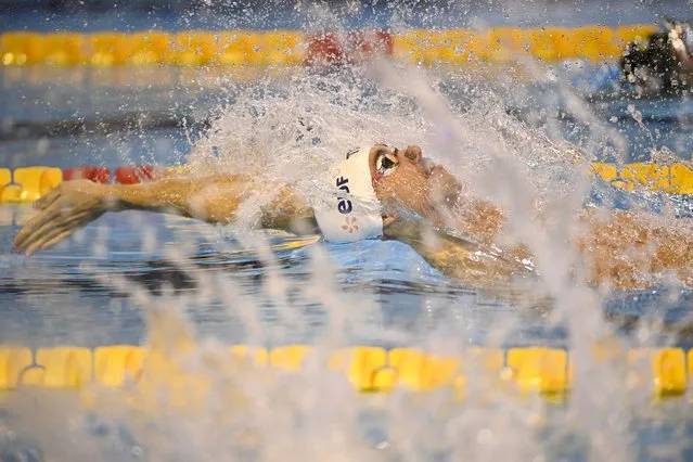 France's Mewen Tomac competes in the Men's 50m Backstroke, in which he won the gold medal, at the LEN European Short Course Swimming Championships in Otopeni, Romania, Wednesday, December 6, 2023. (Photo by Alexandru Dobre/AP Photo)