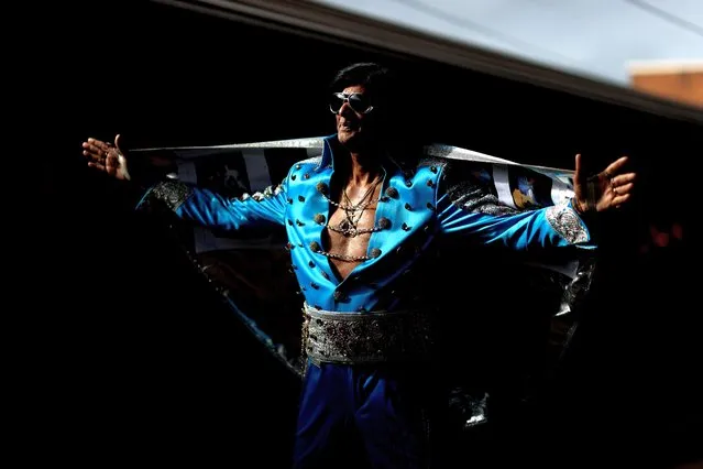 An Elvis impersonator poses prior to boarding the Elvis Express at Central Station on January 05, 2023 in Sydney, Australia. The Parkes Elvis Festival is held annually over five days, timed to coincide with Elvis Presley's birth date in January. This year marks the 30th anniversary of the festival. (Photo by Brendon Thorne/Getty Images)