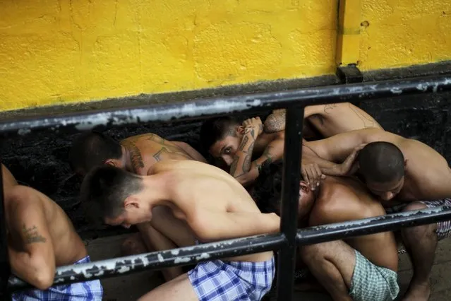 Members of the Barrio 18 gang wait to be admitted upon their arrival to the San Francisco Gotera penitentiary April 21, 2015. (Photo by Jose Cabezas/Reuters)