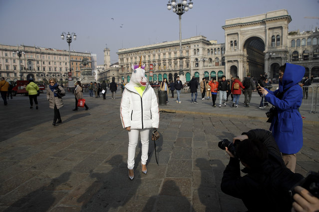 In this picture taken on Tuesday, February 19, 2019, fashion blogger Michelle, poses for photographers after the Alberto Zambelli women's Fall-Winter 2019-2020 fashion show, that was presented in Milan, Italy. (Photo by Luca Bruno/AP Photo)