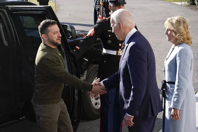 President Joe Biden shakes hands with Ukrainian President Volodymyr Zelenskyy as he welcomes him to the White House, Wednesday, December 21, 2022, in Washington. First lady Jill Biden is at right. (Photo by Patrick Semansky/AP Photo)
