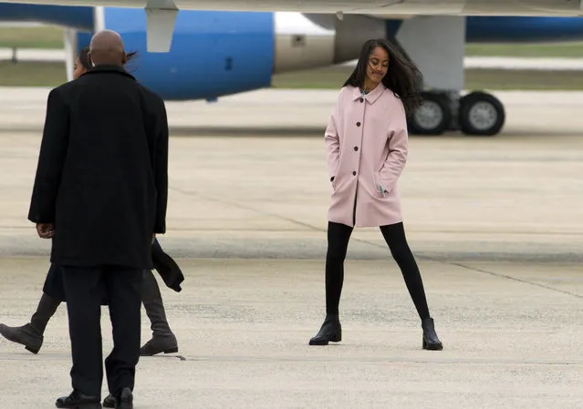 Malia Obama walks towards Air Force One upon the arrival of the first family to Andrews Air Force Base, before their departure, Sunday, March 20, 2016, en route to Havana, Cuba. (Photo by Jose Luis Magana/AP Photo)
