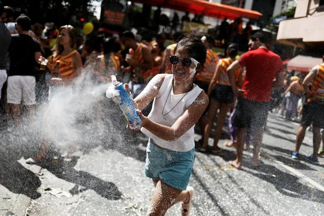 A reveller plays as she takes part in the annual carnival block party known as “Grande Familia” or “Big Family” in Sao Paulo, Brazil, February 11, 2017. (Photo by Nacho Doce/Reuters)