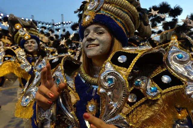 Revelers of the Academicos do Tatuape samba school perform during the second night of carnival parade at the Sambadrome in Sao Paulo, Brazil on March 2, 2014. (Photo by Nelson Almeida/AFP Photo)
