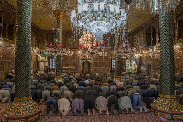 Kashmiri Muslims pray inside the shrine of Shah-e-Hamadan during the holy fasting month of Ramadan in Srinagar, Indian controlled Kashmir, Wednesday, March 20, 2024. Muslims across the world are marking the holy month of Ramadan, a period of intense prayer, self-discipline, dawn-to-dusk fasting and nightly feasts. (Photo by Dar Yasin/AP Photo)