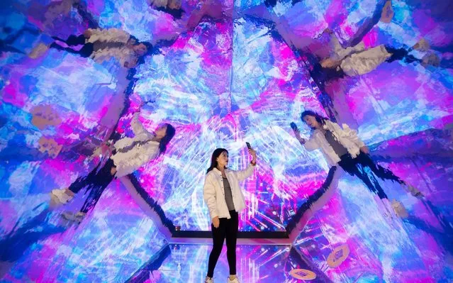 A visitor takes selfies in the “Kaleidoscope” installation at an experience centre on May 27, 2019 in Hohhot, Inner Mongolia Autonomous Region of China. (Photo by Ding Genhou/VCG via Getty Images)