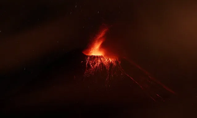 The Tungurahua volcano spews lava after its eruption, in Quito, Ecuador, 03 March 2016. The Tungurahua volcano that was relatively calm since November 2015, resume its eruptive activity with five explosions on 26 February, sending huge clouds of ashes and smoke into the sky. (Photo by Jose Jacome/EPA)