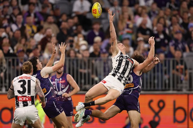 Brody Mihocek of the Magpies flys for a mark during the round 11 AFL match between Walyalup (the Fremantle Dockers) and Collingwood Magpies at Optus Stadium, on May 24, 2024, in Perth, Australia. (Photo by Paul Kane/Getty Images)