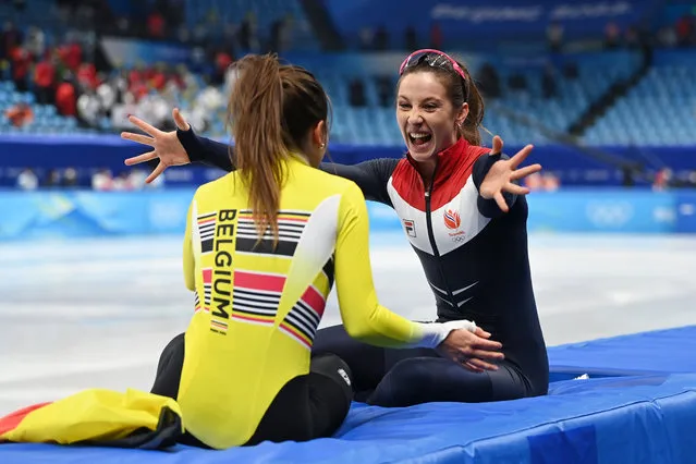 Gold medallist Suzanne Schulting of Team Netherlands celebrates with  Bronze medallist Hanne Desmet of Team Belgium after the Women's 1000m Final A on day seven of the Beijing 2022 Winter Olympic Games at Capital Indoor Stadium on February 11, 2022 in Beijing, China. (Photo by David Ramos/Getty Images)