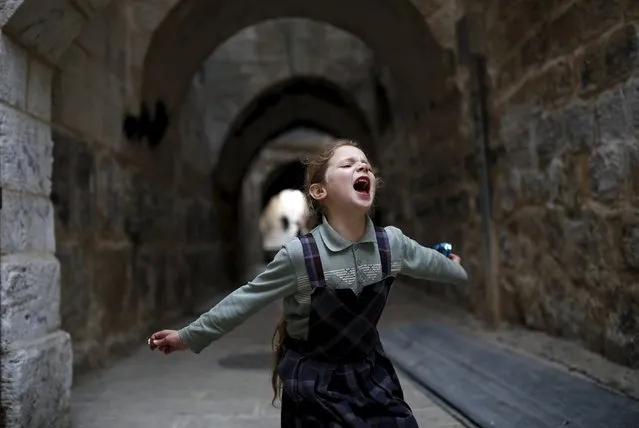 A Jewish girl plays in Jerusalem's Old City April 8, 2016. (Photo by Amir Cohen/Reuters)