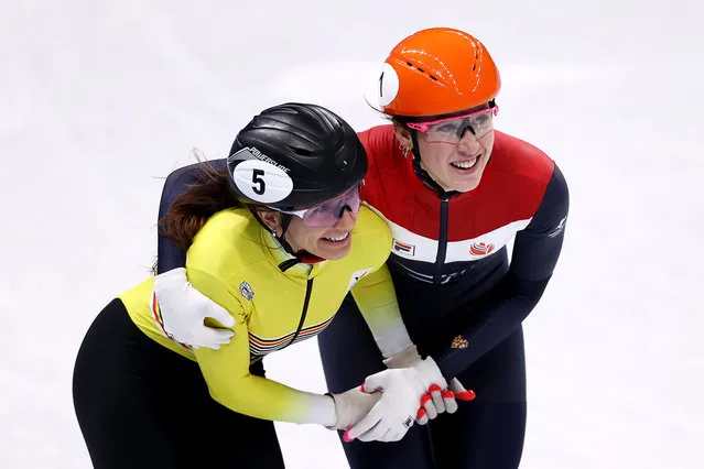Hanne Desmet of Team Belgium and Suzanne Schulting of Team Netherlands react after skating during the Women's 1500m Semifinals on day twelve of the Beijing 2022 Winter Olympic Games at Capital Indoor Stadium on February 16, 2022 in Beijing, China. (Photo by Dean Mouhtaropoulos/Getty Images)