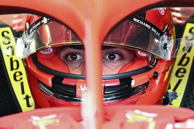 Ferrari's Spanish driver Carlos Sainz sits his car in the pits prior to the first practice session on the Red Bull Ring race track in Spielberg, Austria, on June 28, 2024, ahead of the Formula One Austrian Grand Prix. (Photo by Joe Klamar/AFP Photo)