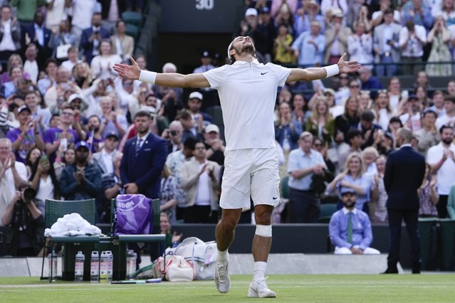 Lorenzo Musetti of Italy celebrates after defeating Taylor Fritz of the United States in their quarterfinal match at the Wimbledon tennis championships in London, Wednesday, July 10, 2024. (Photo by Alberto Pezzali/AP Photo)