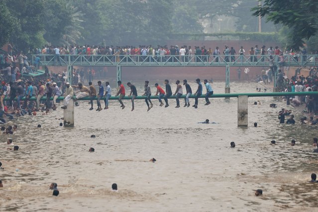 People swim in the lake inside Ganabhaban, the Prime Minister's residence, after the resignation of the Sheikh Hasina in Dhaka, Bangladesh, on August 5, 2024. (Photo by Mohammad Ponir Hossain/Reuters)