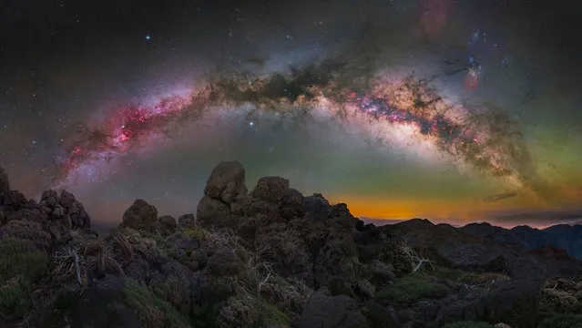 Milky Way arch in the morning hours of spring – La Palma, Canary Islands – Spain. “During the spring months, the Milky Way core starts to appear in the south-east part of the early morning sky, so it becomes possible to photograph the whole Milky Way arch at an almost 180-degree angle from north to south. I chose Pico de la Cruz, one of the summits on La Palma Island, as my main location to spend the night shooting our galaxy. Around 4am, the Milky Way was high enough in the sky that I could start shooting at 50mm and capture an arch shape without any distortion of the surrounding stars”. (Photo by Egor Goryachev/Milky Way Photographer of the Year)