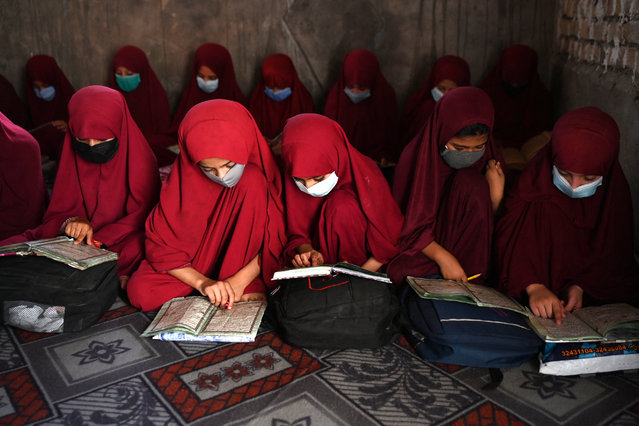 Afghan girls read the holy Koran at Madrassa Abdullah Bin Omar darul uloom (Islamic school) in Kandahar on August 28, 2024. (Photo by Wakil Kohsar/AFP Photo)