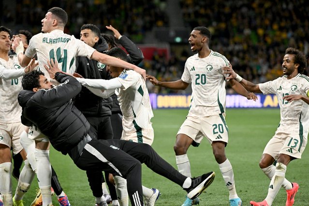 Players from Saudi Arabia react after scoring a goal, which is later disallowed, during the 2026 World Cup Asian qualification football match between Australia and Saudi Arabia at the Melbourne Rectangular Stadium in Melbourne on November 14, 2024. (Photo by William West/AFP Photo)