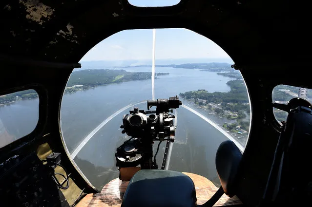 A view from the front gun turret on The Memphis Belle,  a B-17 bomber, as it flies over Baltimore. (Photo by Jonathan Newton/The Washington Post)