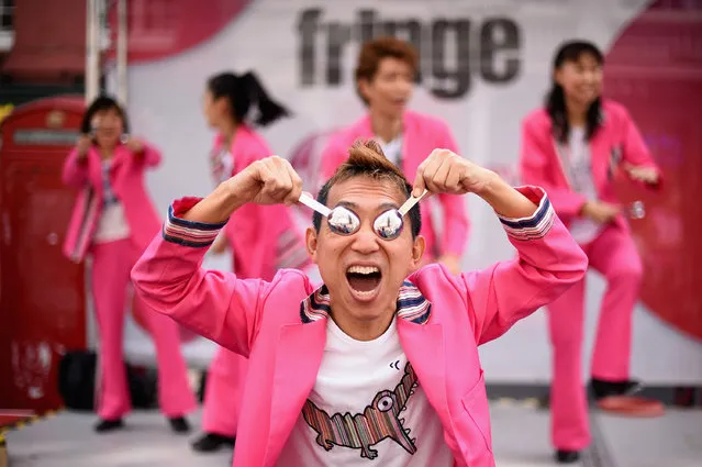 Sushi Tap Show perform in the Edinburgh Festival Fringe on the Royal Mile on August 14, 2014 in Edinburgh, Scotland. The largest performing arts festival in the world, this year's festival hosts more than 3,000 shows in nearly 300 venues across the city. (Photo by Jeff J. Mitchell/Getty Images)