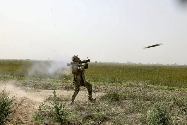 In this handout photo taken from video released by Russian Defense Ministry Press Service on Sunday, September 11, 2022, A Russian paratrooper fires a Russian man-portable missile on a mission on the Nikolaev-Krivoy Rog direction in Ukraine. (Photo by Russian Defense Ministry Press Service via AP Photo)