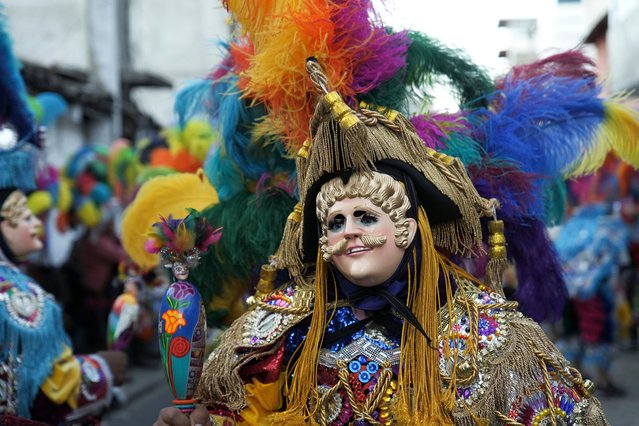 Members of a Guatemalan dance group dressed in traditional clothes and using masks perform the traditional “El Torito” (Little Bull) dance during the procession in honor of Santo Tomas in Chichicastenango, Guatemala, on December 20, 2023. (Photo by Emmanuel Andres/AFP Photo)