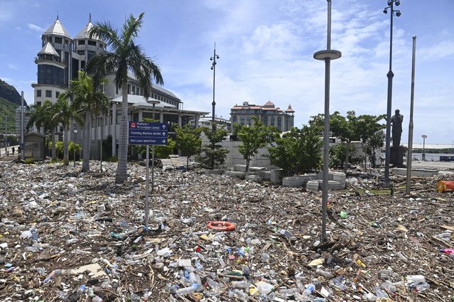 Debris washed up during the cyclone is strewn across the Caudan Waterfront in Port Louis, the capital city of Mauritius, Tueday January 16, 2024. Mauritius lifted its highest weather alert and eased a nationwide curfew Tuesday after a cyclone battered the Indian Ocean island, causing heavy flooding and extensive damage in the capital city and other parts of the country. (Photo by Lexpress.mu via AP Photo)